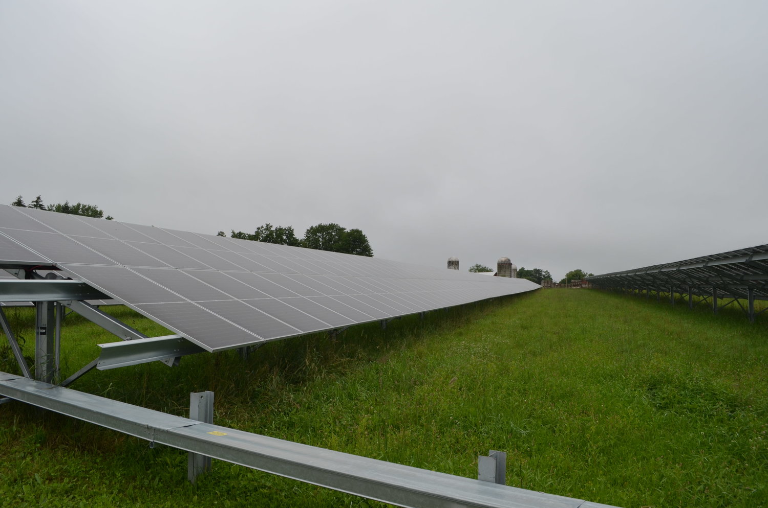 A field of solar panels on farmland in the town of Bethel.